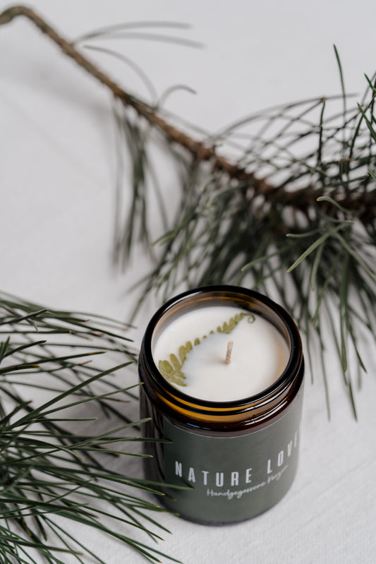 Soy wax candle in a glass with lemongrass essential oil